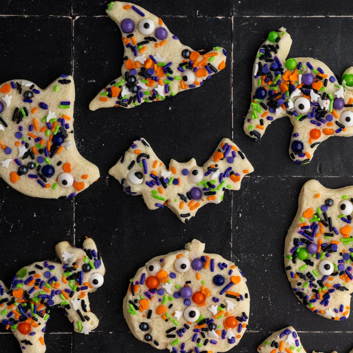Halloween Sugar Cookies with Sprinkles cut into a variety of Halloween-themed shapes.