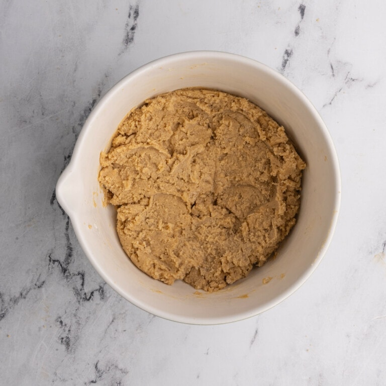 Light brown sugar based Christmas cookie dough in a bowl.