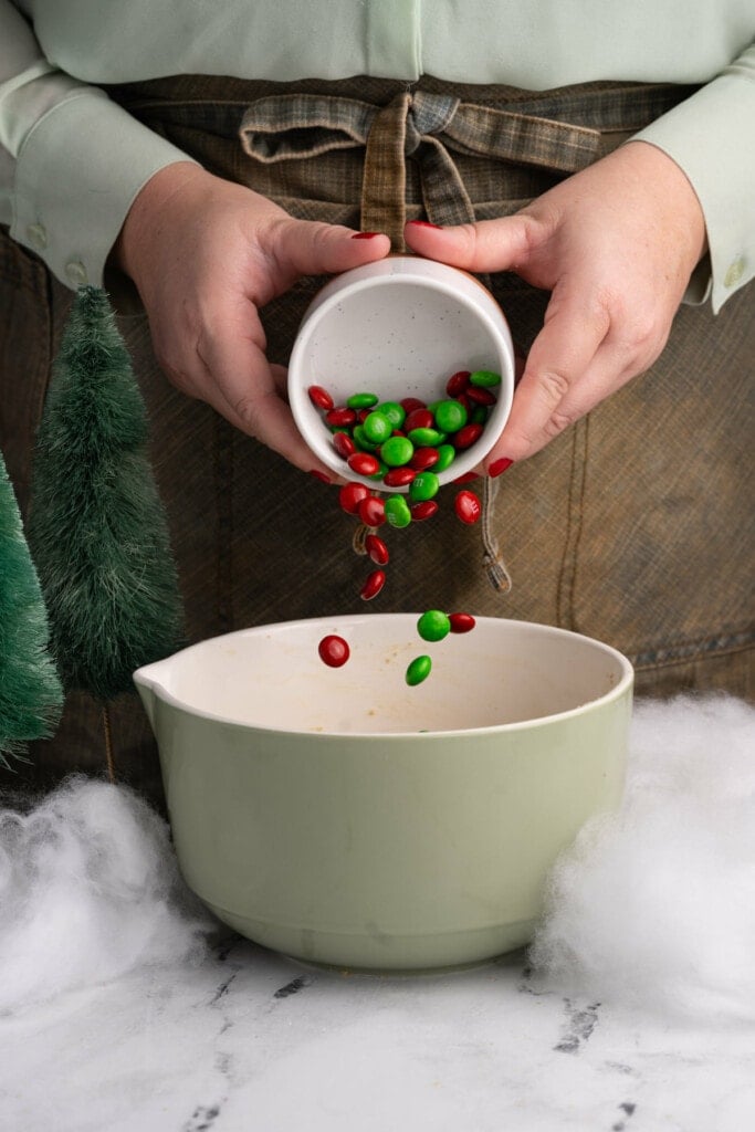 Adding just green and red M&M's to cookie dough to make them festive for Christmas.