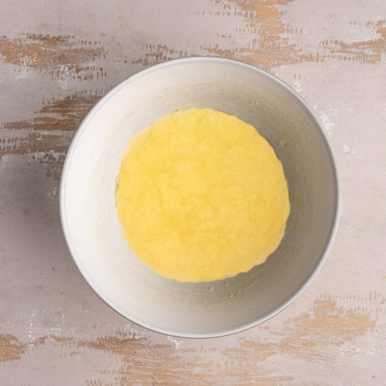 Melted butter and white chocolate chips in mixing bowl