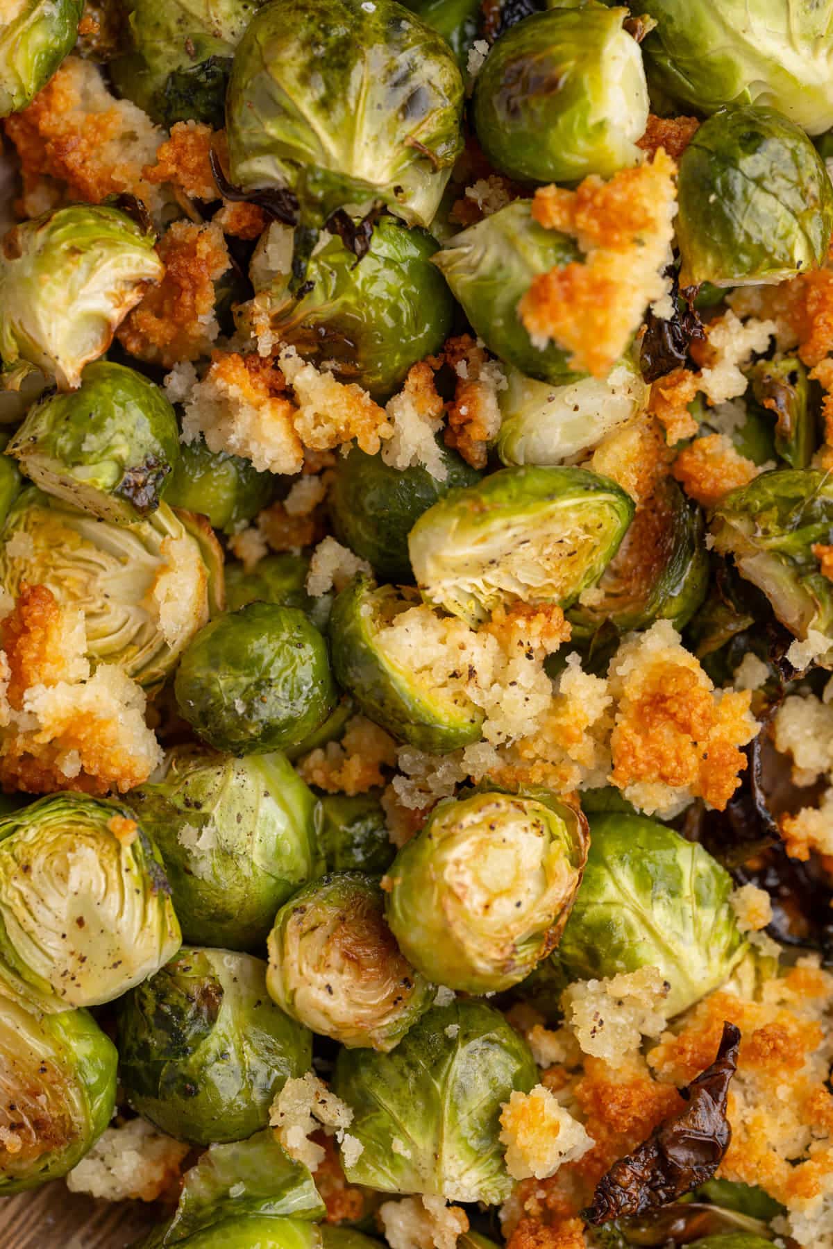 Close up of roasted brussels sprouts with crispy Parmesan crust. 