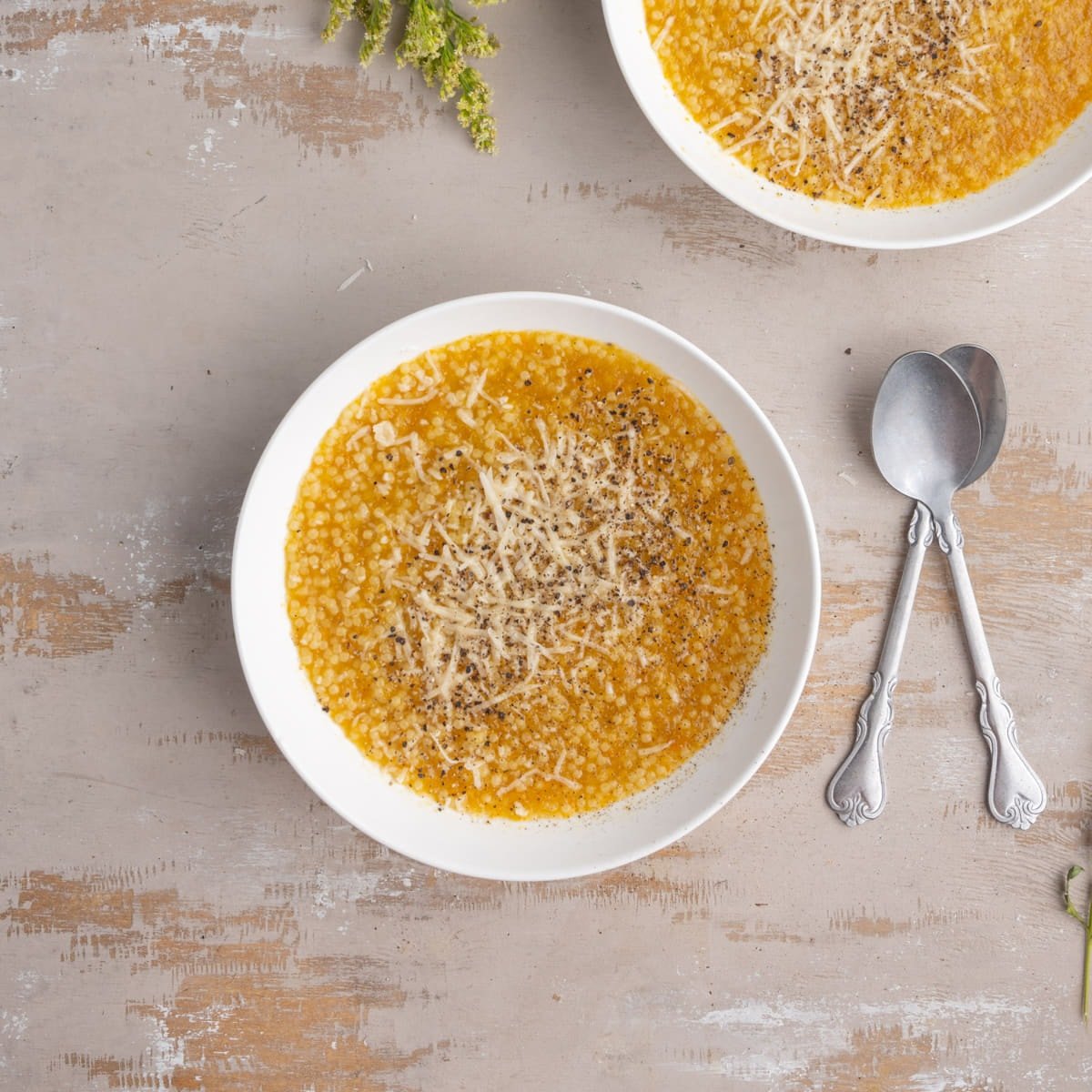 Pastina Soup with a hearty vegetable broth and finished with Parmigiano-Reggiano and black pepper.