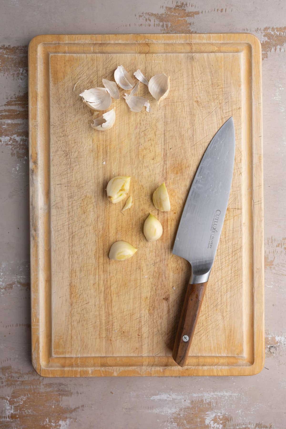 Peeled garlic to add to a vegetable-based broth.
