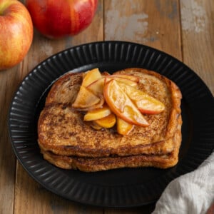 Apple Cider French toast with cinnamon sugar apples on top.