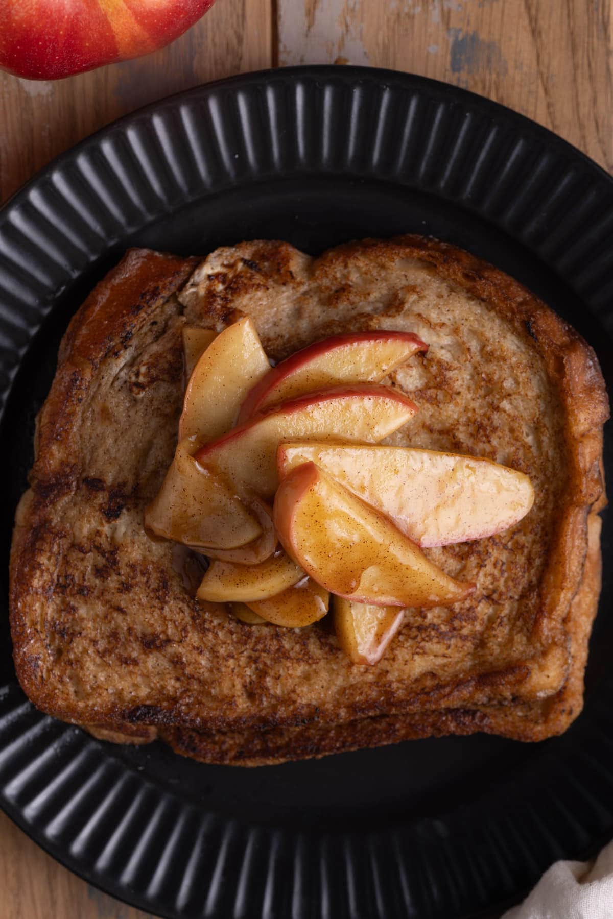 Close up of Fall French toast topped with sauteed apples. 
