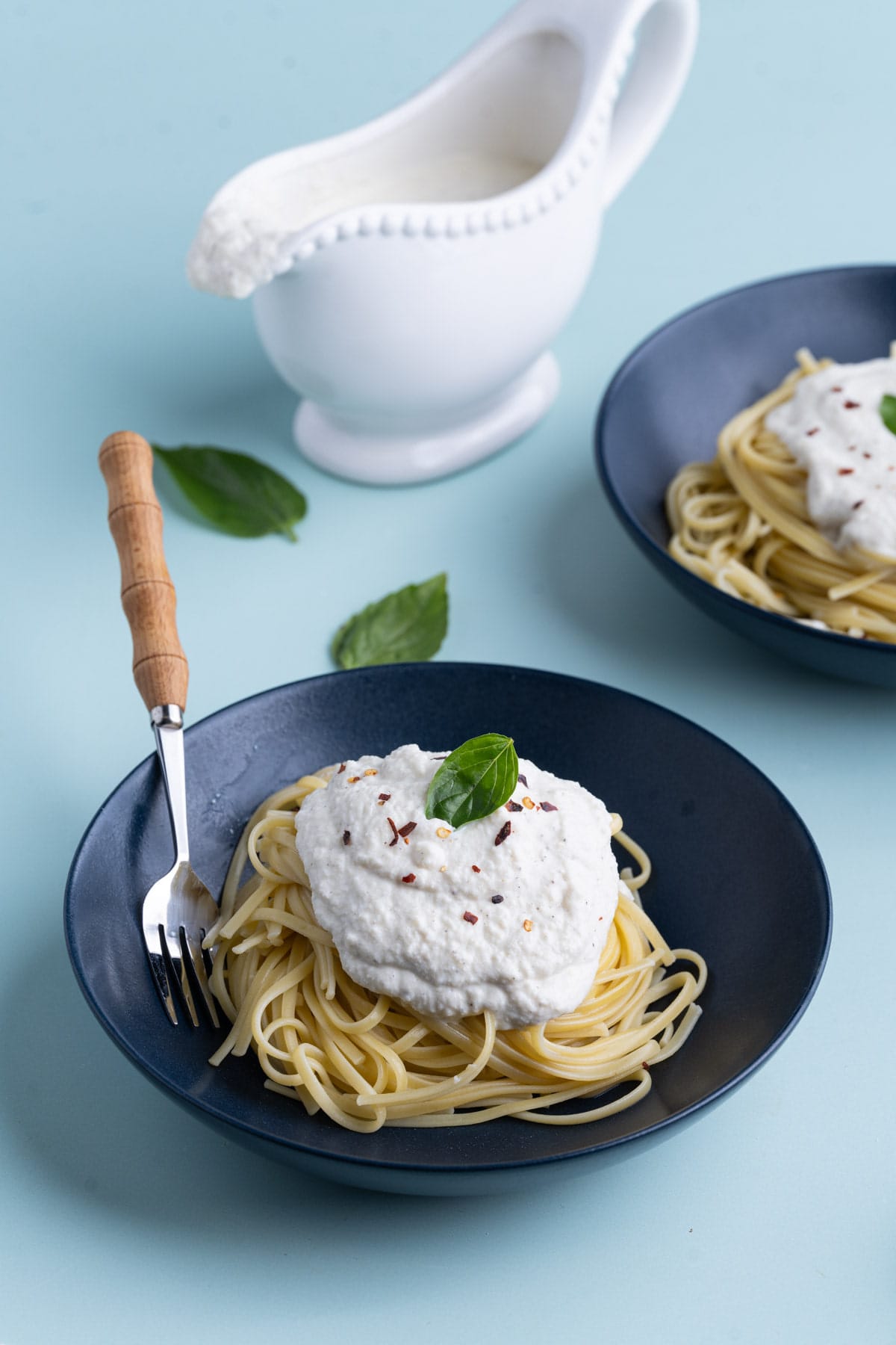 Ricotta Cheese Sauce served over linguine with basil.