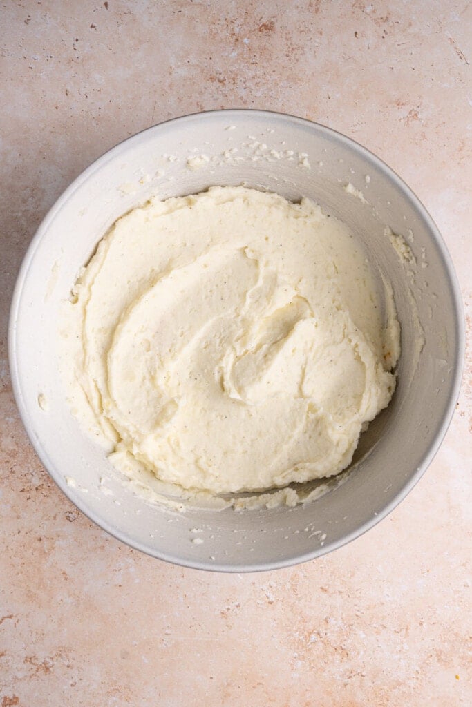 Large mixing bowl with leftover mashed potatoes whipped with cream cheese.