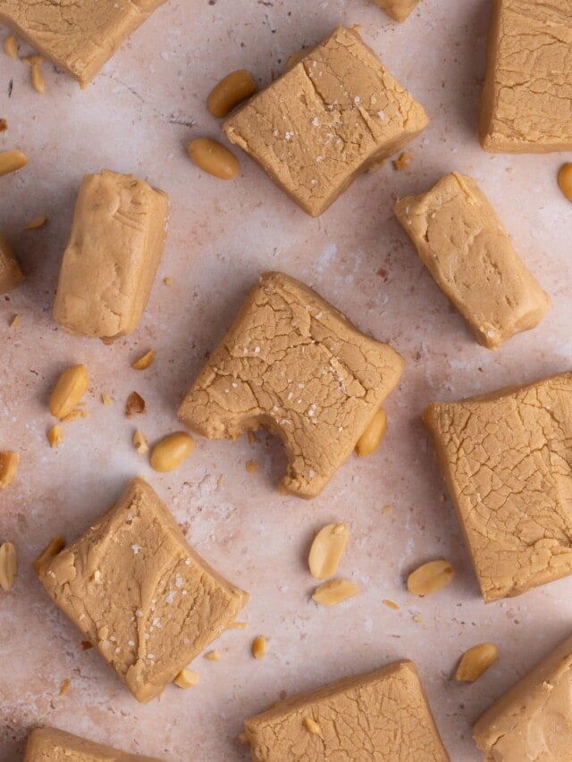 Pieces of No-Bake Peanut Butter Fudge with a bite taken from the center piece