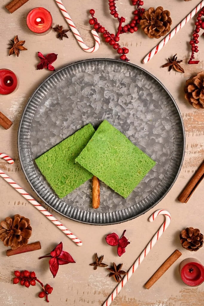 Assembling green pancakes to resemble a Christmas tree. 