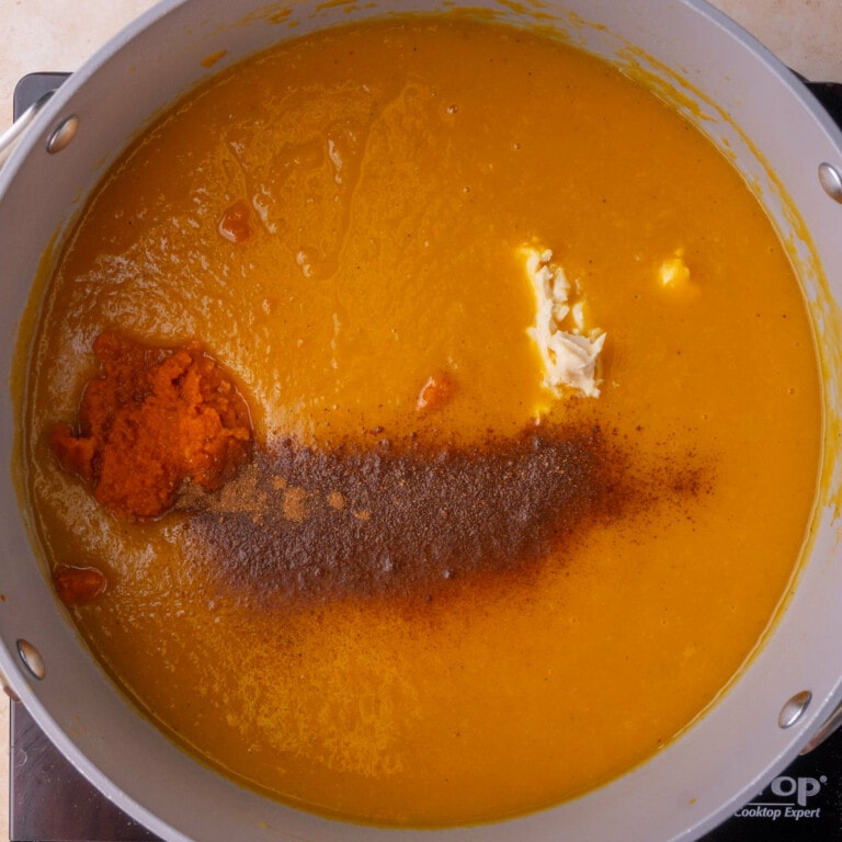 Butternut squash soup with cream cheese, pumpkin puree, and pumpkin pie spice added.