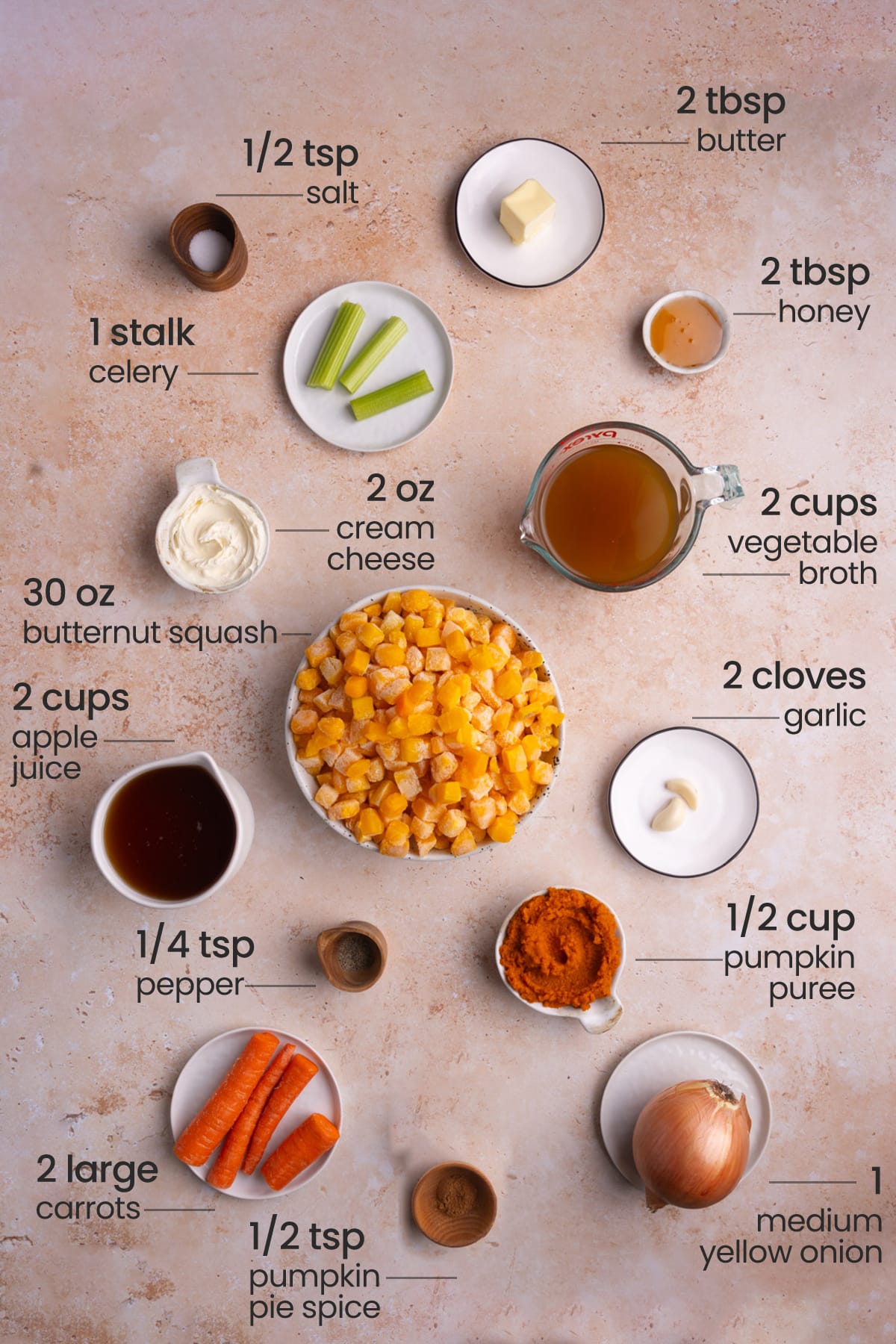 ingredients for autumn squash soup - salt, butter, honey, celery, cream cheese, vegetable broth, butternut squash, apple juice, garlic, pepper, pumpkin puree, carrots, pumpkin pie spice, yellow onion