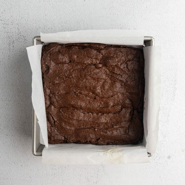 Just-baked brownies cooling before adding peanut butter and ganache layers.
