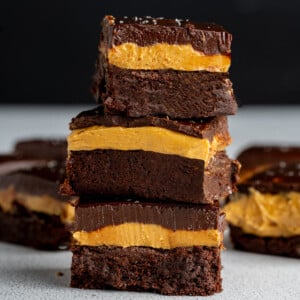 Buckeye brownies stacked on top of eachother to show all three layers.