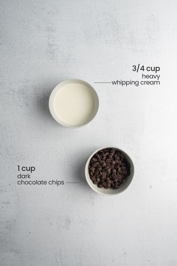 Ingredients needed for chocolate ganache layer of buckeye brownies including dark chocolate chips and heavy whipping cream.