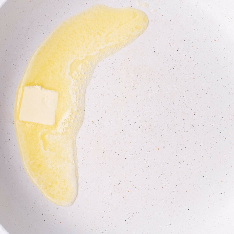 Butter melting in a pan to fry up crispy Pumpkin French Toast.