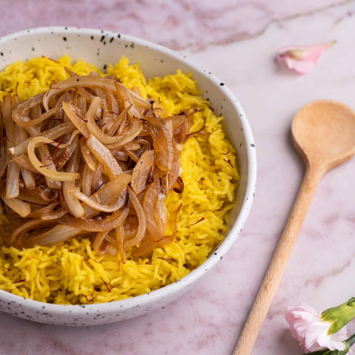 A bowl of yellow saffron rice, one of 24 side dishes with 5 ingredients or less.