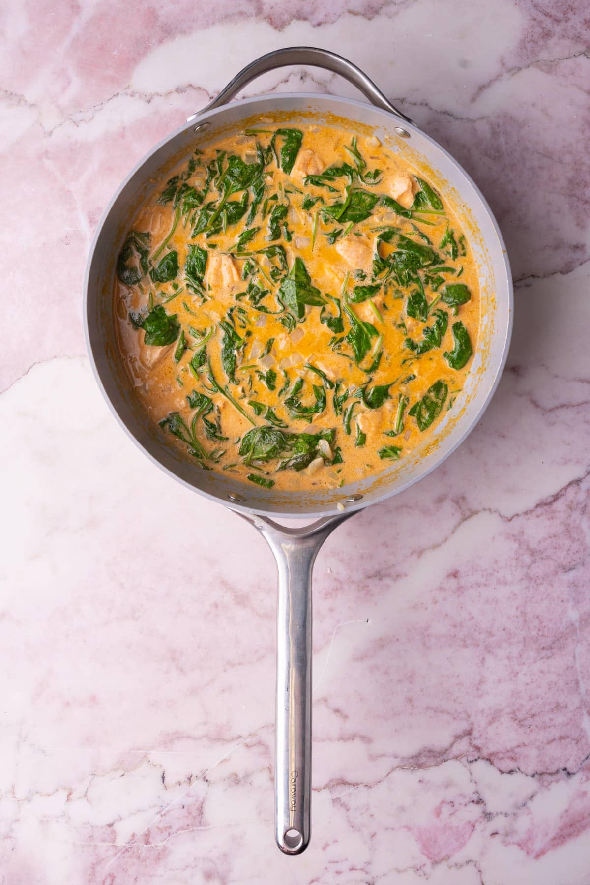 Salmon coconut curry with spinach ready to serve.