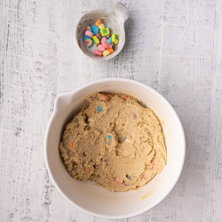 Lucky Charms cookie dough with extra Lucky Charms marshmallows on the side.