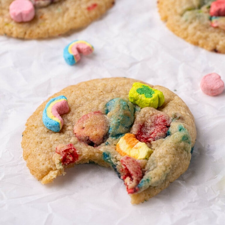 Close up of Lucky Charms cookie with a bite taken out of it.