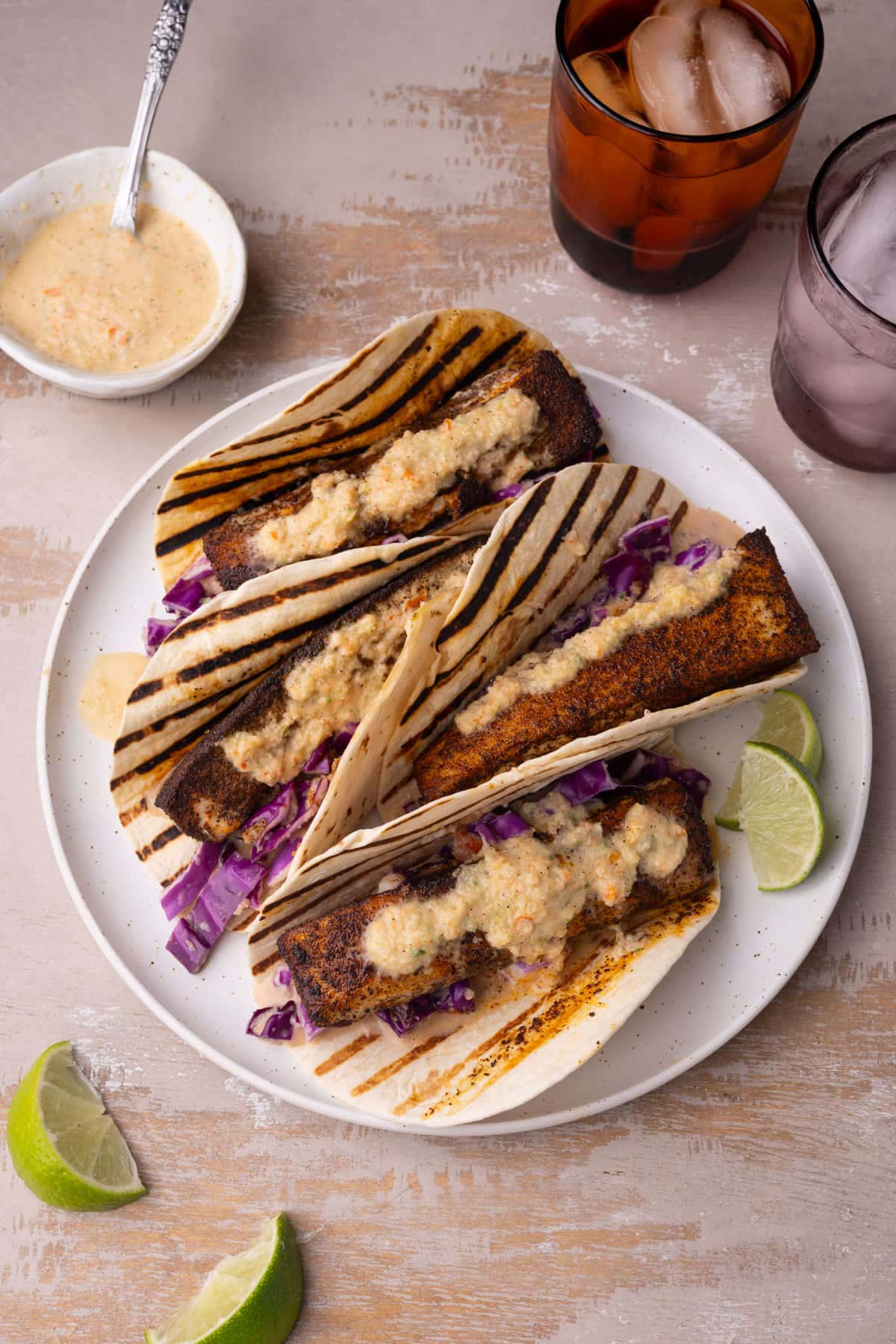 Saucy fish tacos made red cabbage slaw. 