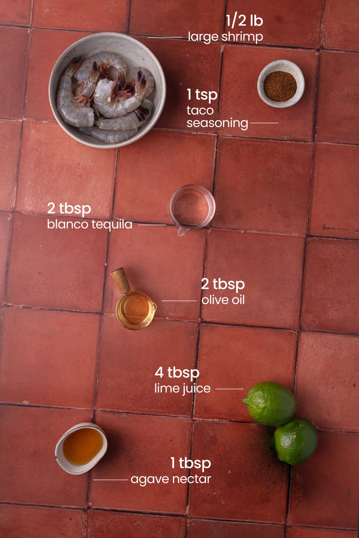 All ingredients needed for tequila lime shrimp including shrimp, taco seasoning, blanco tequila, olive oil, lime juice, and agave nectar.