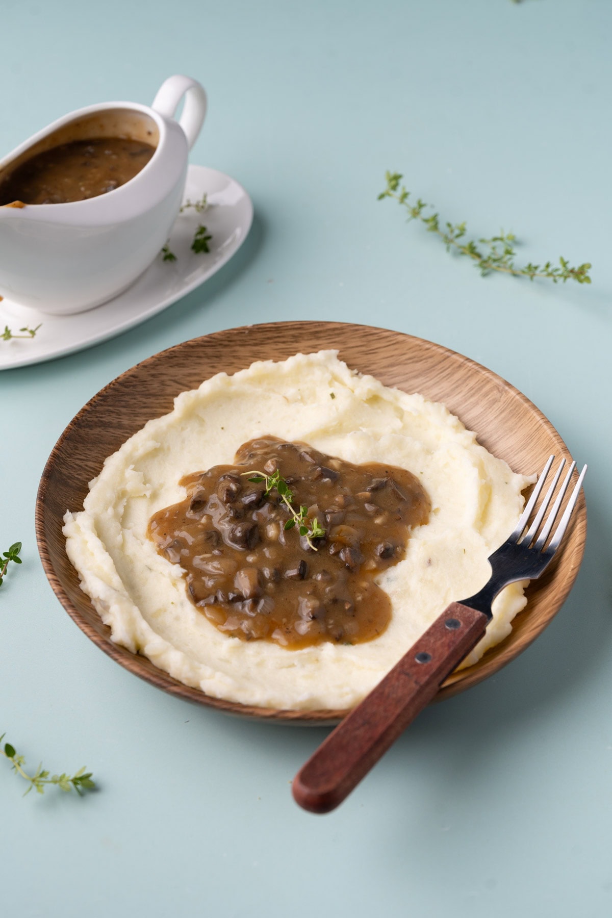 Vegan mushroom gravy served atop a bed of fluffy mashed potatoes. 