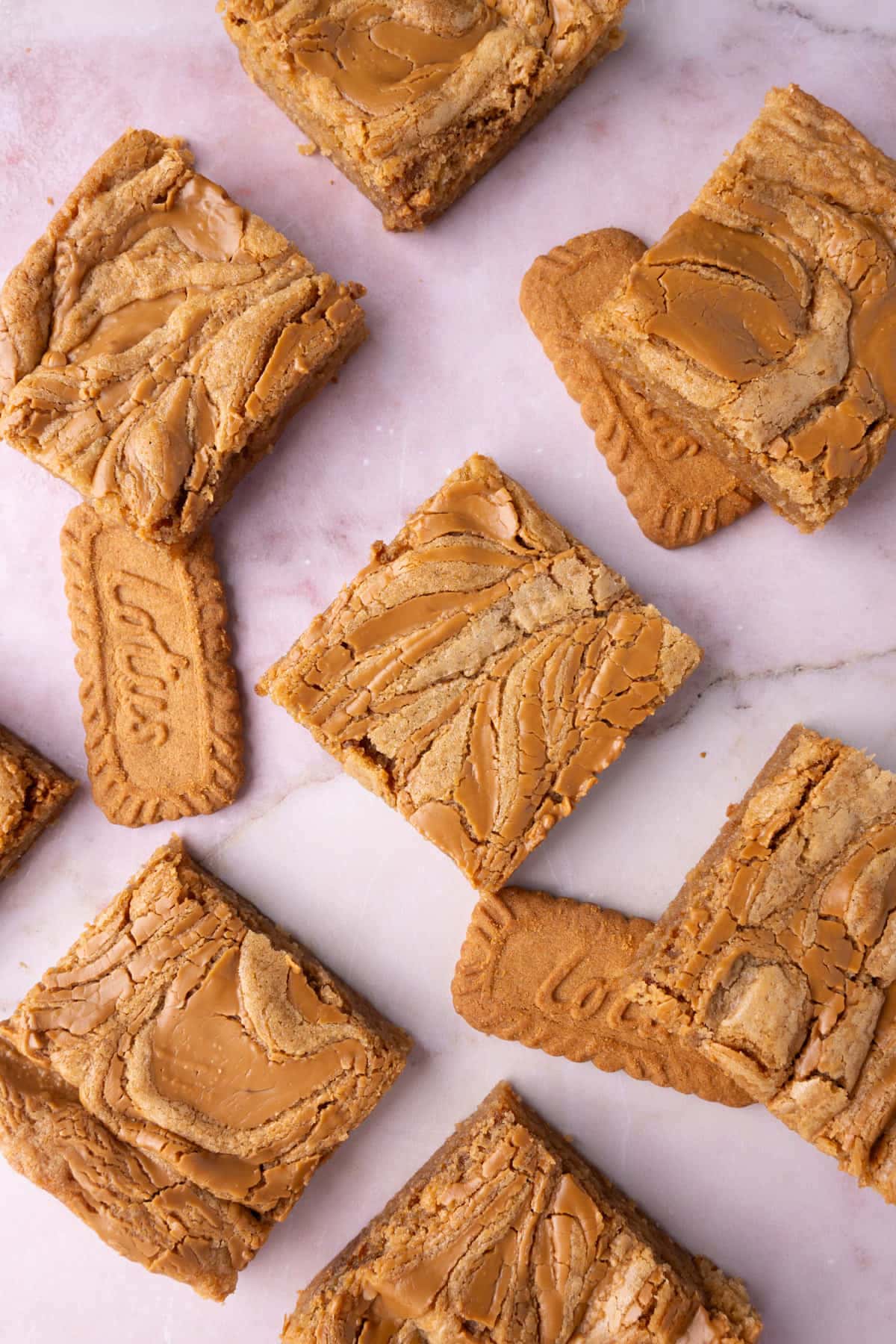 Cookie butter blondies sliced and placed over Biscoff cookies. 