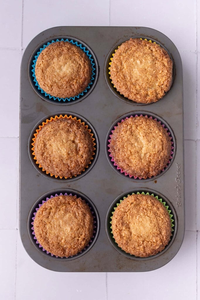 Graham cracker cookie dough baked in a muffin tin fresh out of the oven.