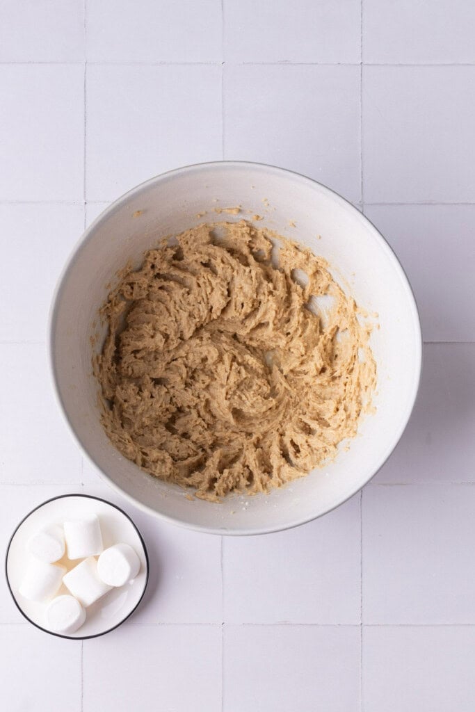 Softened unsalted butter and light brown sugar creamed together in a large mixing bowl. 