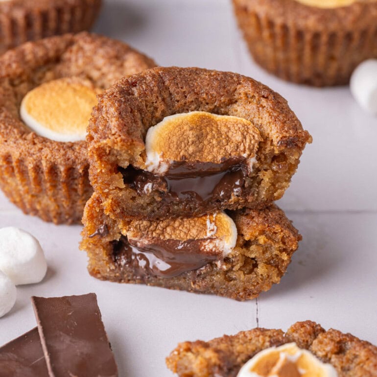 Two halves of smore cookie cups stacked on top of eachother.