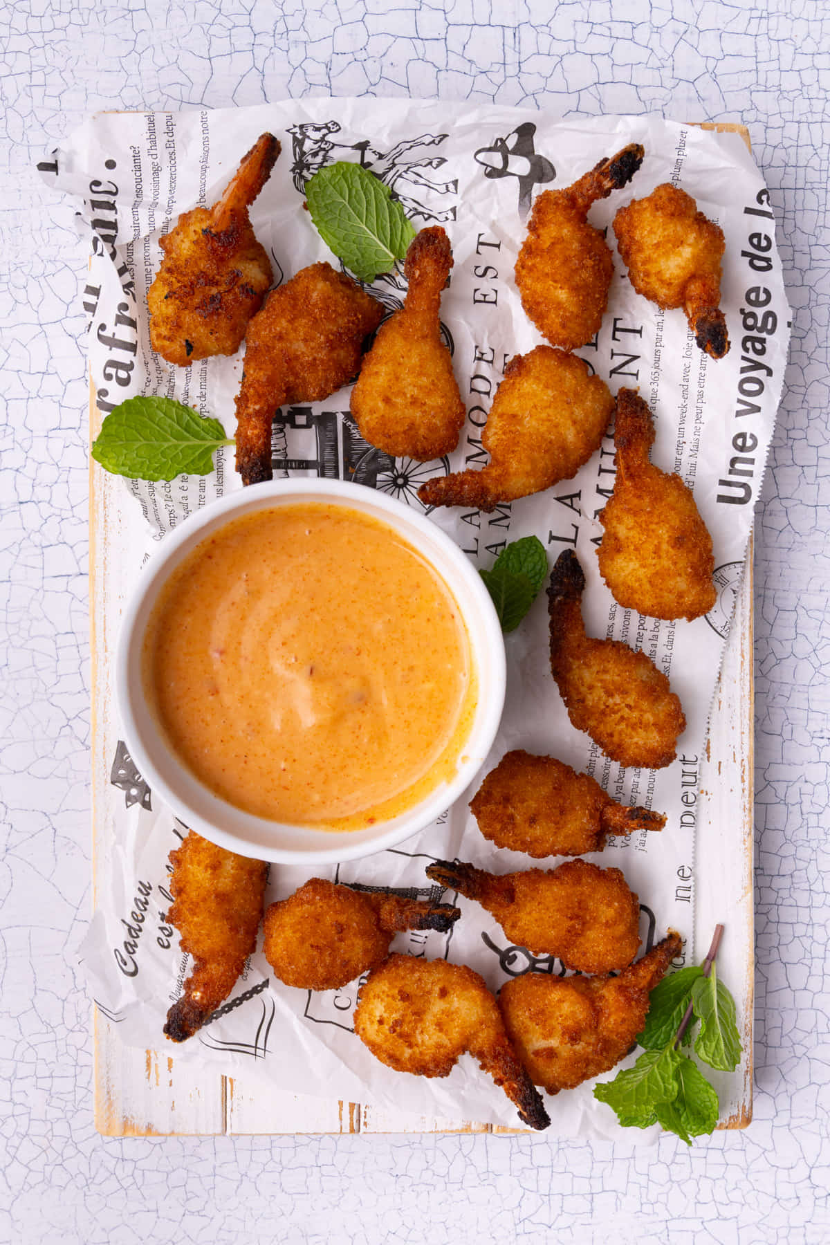 Overhead image of platter of fried shrimp with Bang Bang sauce. 