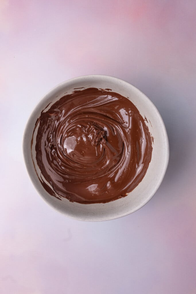 Melted dark chocolate chips in a bowl. 