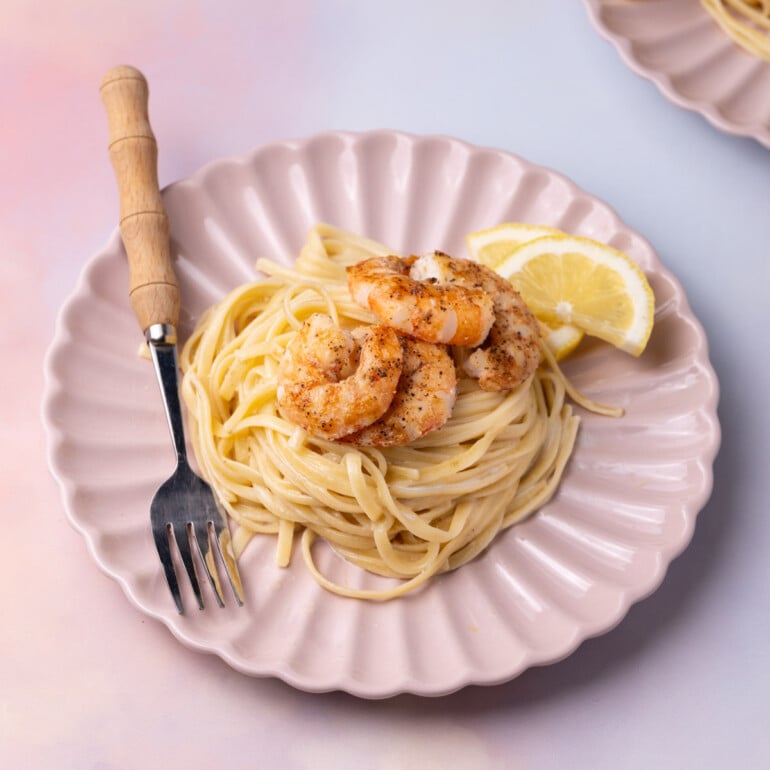 Shrimp pasta with creamy garlic sauce and lemon.