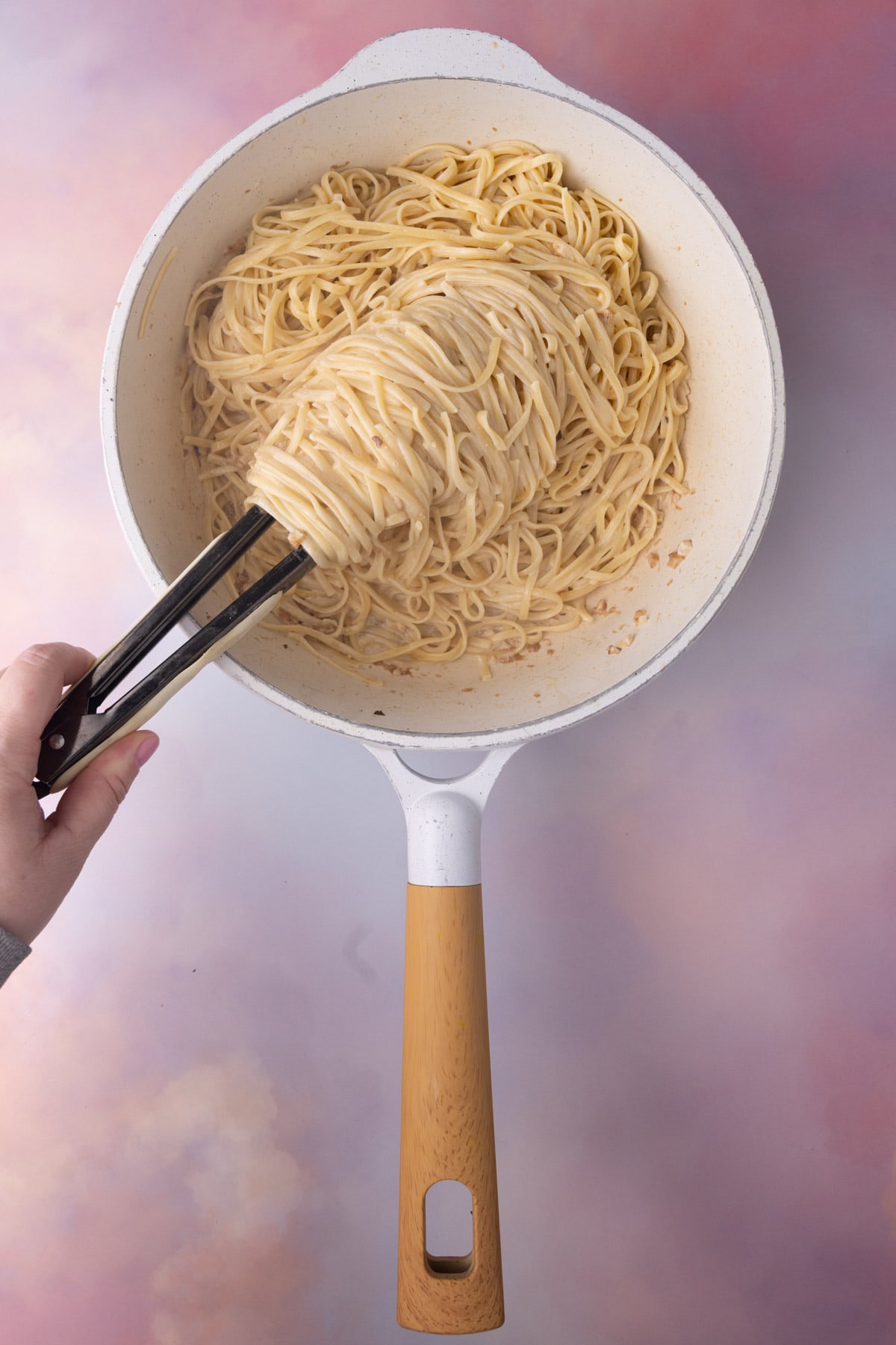 Creamy pasta in a pan ready to be served with garlic shrimp. 