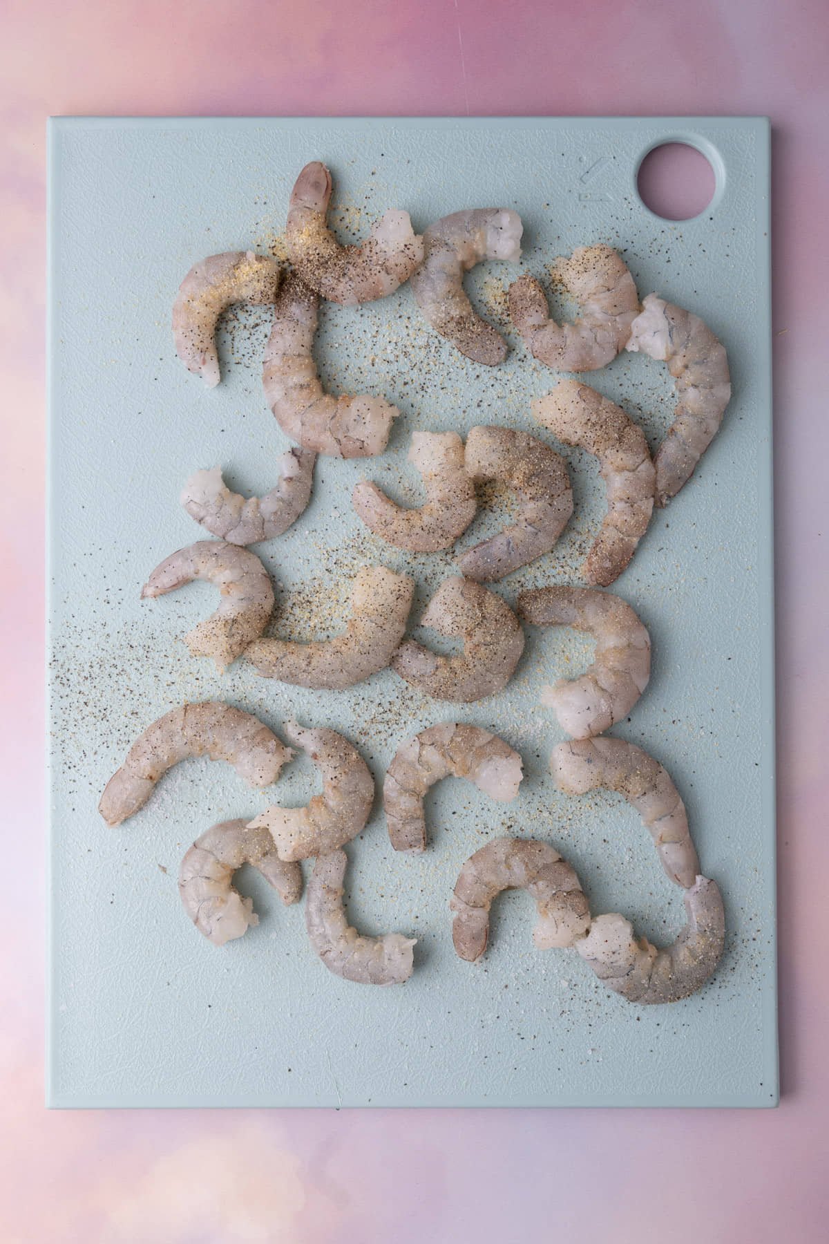 Raw large white shrimp peeled and seasoned with lemon juice, salt, pepper, and garlic powder. 
