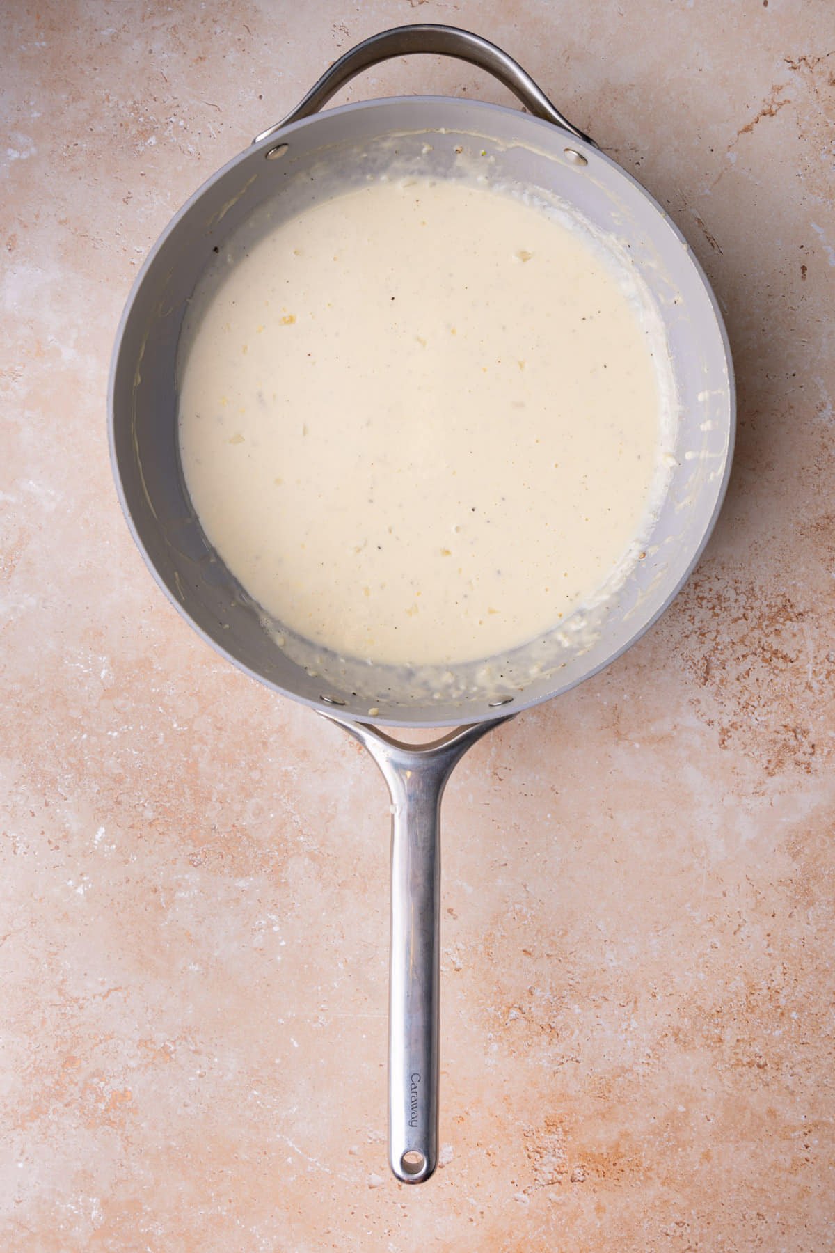 Creamy Parmesan garlic sauce still hot in pan. 