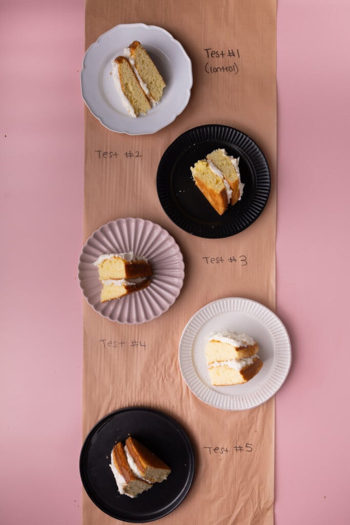 Six slices of frosted cake made with a box mix all with slight variations to find the best.