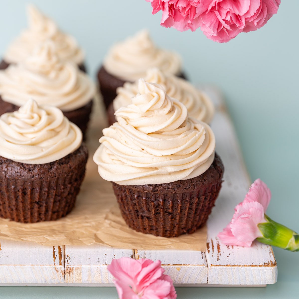 Chocolate cupcakes with generous piping of Irish Cream Buttercream on top.