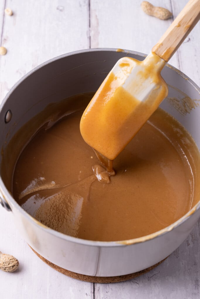 Smooth peanut butter ganache in a pot just melted together. 