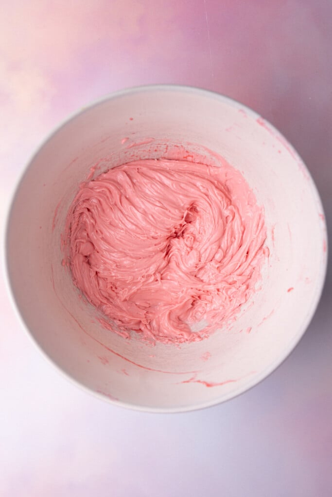 Softened butter and raspberry juice creamed together in a large bowl. 