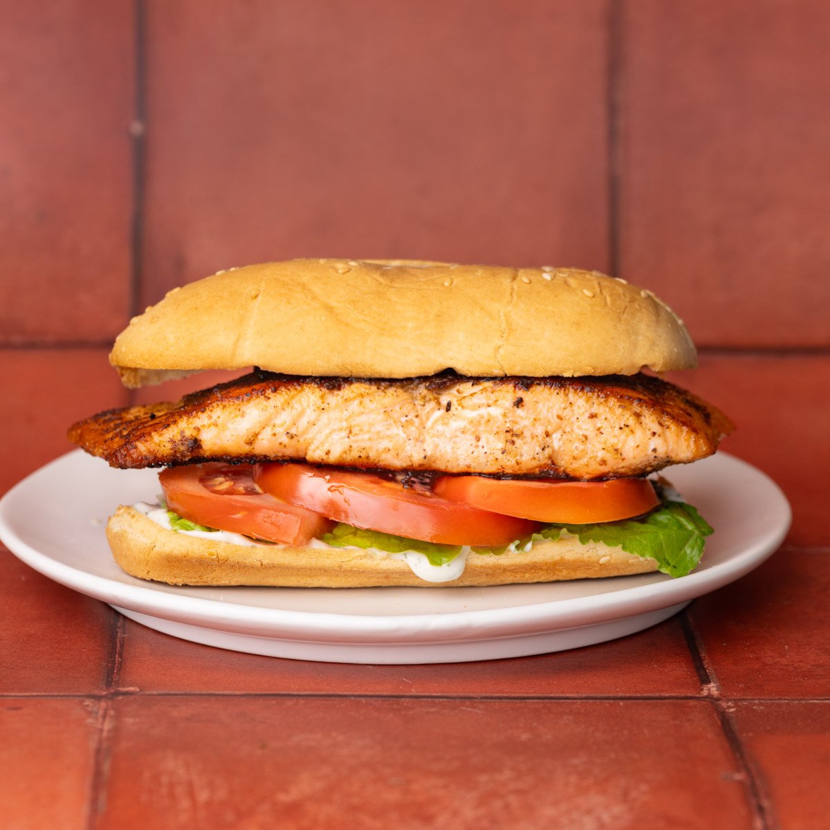 Simple salmon sandwich on a hoagie roll.