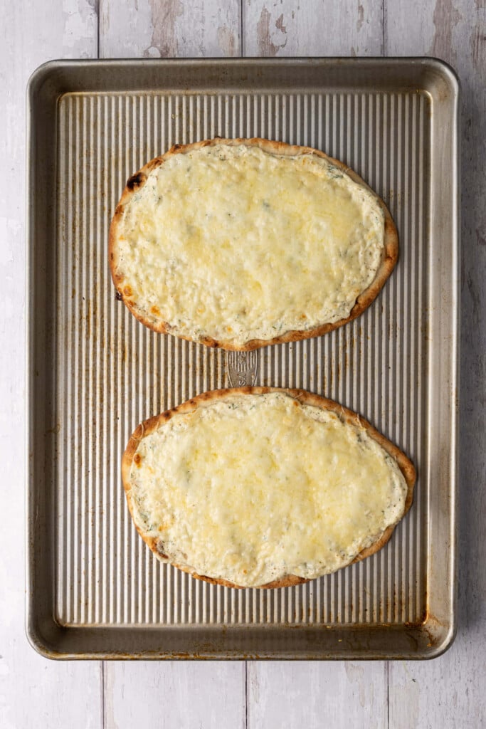 Naan flatbread with ricotta baked for 8-10 minutes until the mozzarella and Parmesan cheese is nice and melted. 