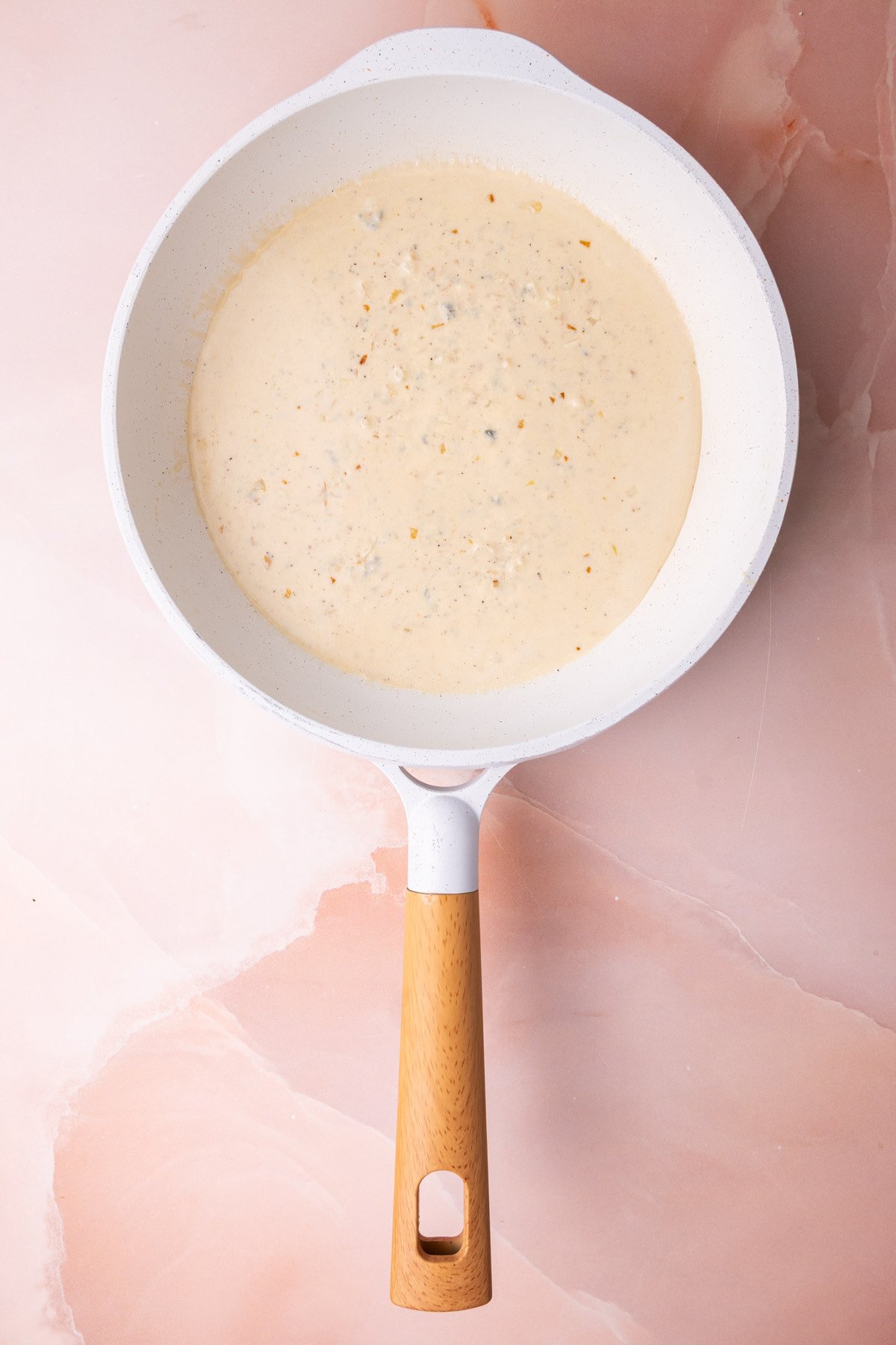 Gorgonzola sauce in a pan just cooked and still hot. 