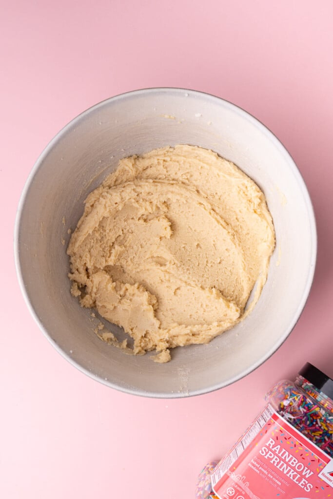 Sugar cookie dough in a large mixing bowl.