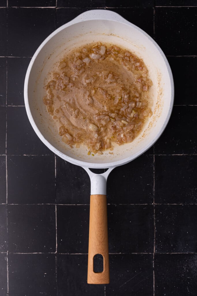 Cooking sherry down in pan with butter, shallots, salt, and pepper.