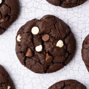 Chewy chocolate cookies with a crinkle top packed with white, milk, and dark chocolate chips.