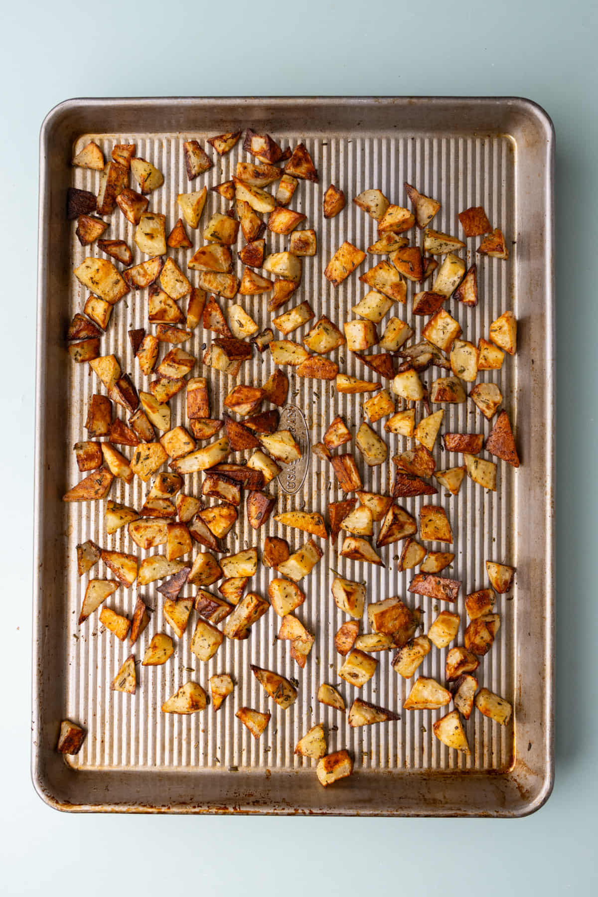 Crispy bite-sized roasted russet potatoes fresh out of the oven.