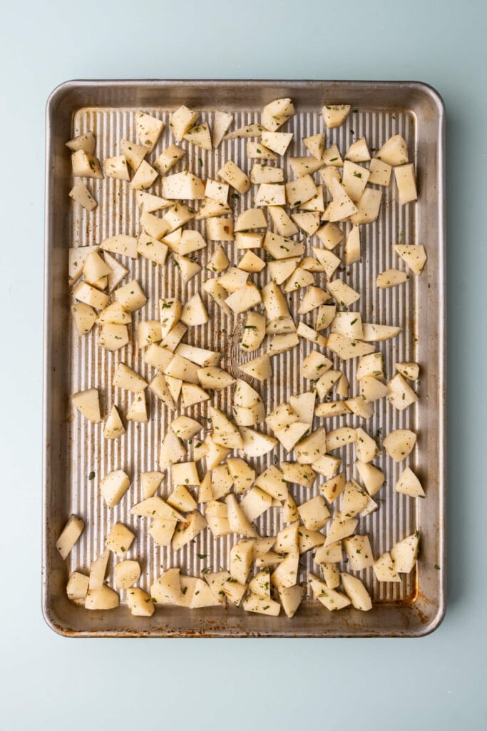 Chopped potatoes tossed with olive oil, salt, pepper, and fresh rosemary.