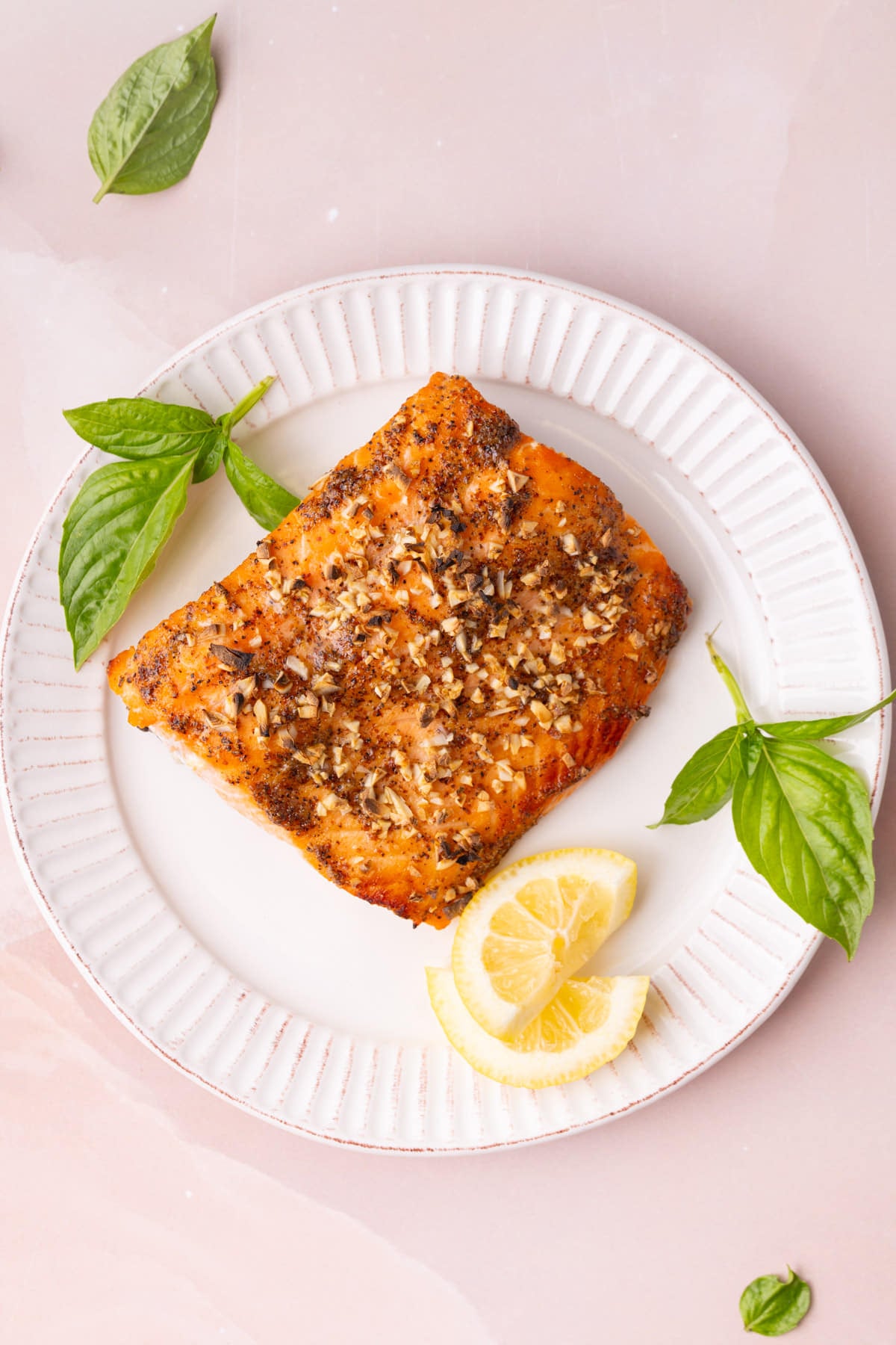 Overhead image of honey mustard salmon on a white ridges plate.