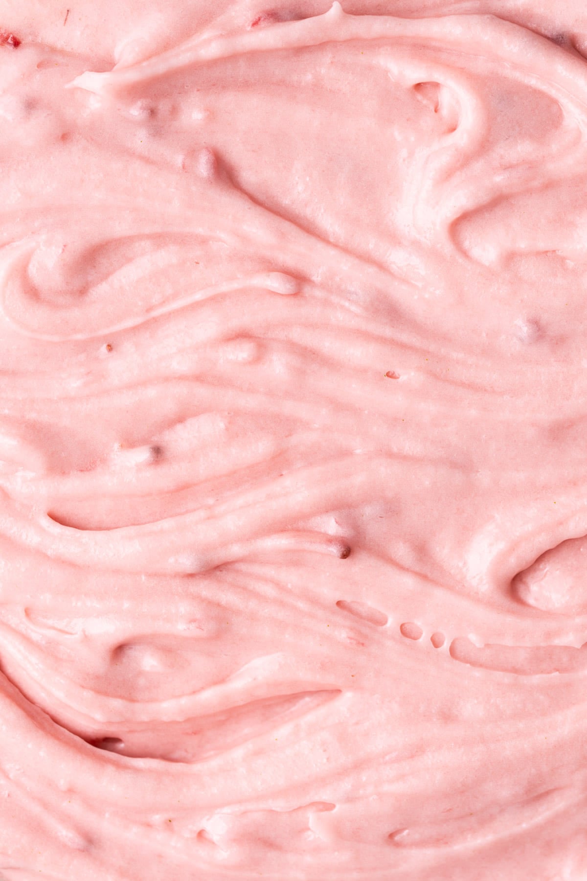 Close up of strawberry cream cheese frosting made with fresh berries.